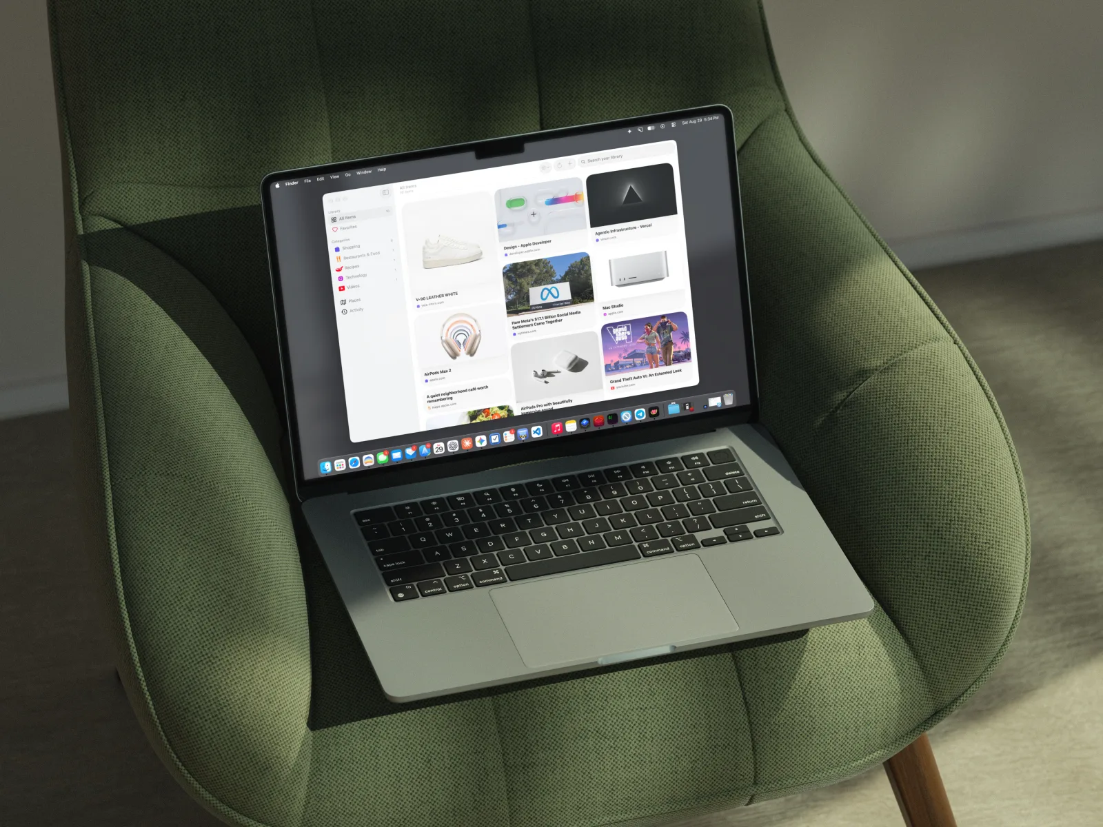 FaveNest open on a MacBook Air resting on a green chair, showing the Library in a native macOS window.